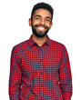 © Krakenimages.com - Young african american man wearing casual clothes looking positive and happy standing and smiling with a confident smile showing teeth