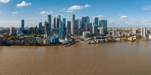 Fototapete - Aerial panoramic skyline view of Canary Wharf, the worlds leading financial district in London, UK. Business center of London.