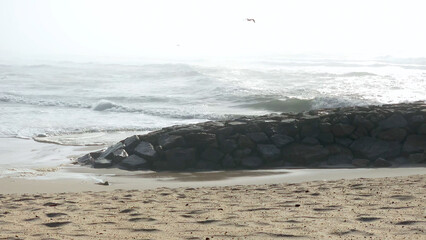 Wall Mural - The sea rises to the seafront of Furadouro in Ovar