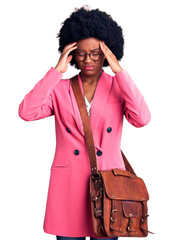 Poster - Young african american woman wearing business clothes and leather bag suffering from headache desperate and stressed because pain and migraine. hands on head.