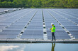 © Narin Sapaisarn - Portrait of professional man engineer working checking the panels at solar energy on buoy floating. Power plant with water, renewable energy source. Eco technology for electric power in industry.