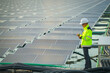 © Narin Sapaisarn - Portrait of professional man engineer working checking the panels at solar energy on buoy floating. Power plant with water, renewable energy source. Eco technology for electric power in industry.