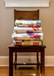 Quilts Stacked on Wooden Chair