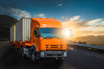 Wall Mural - Heavy duty truck on the road with sunset background. Container logistics, cargo delivery, transportation concept.