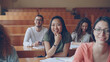 © silverkblack - Pretty Asian girl listening teacher with her classmates are sitting at desks smiling and laughing. Education and youth concept.