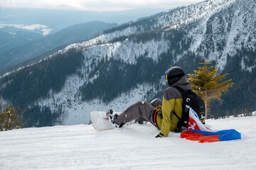 Canvas Print - man snowboarder with slovakia flag at ski resort slope