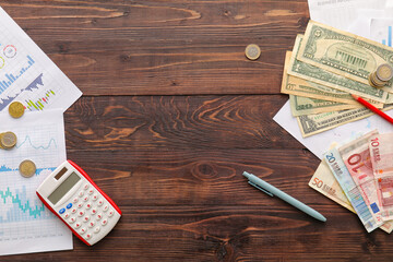 Canvas Print - Frame made of money, calculator, pen and diagrams on dark wooden background. Exchange rate concept