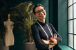 © Jacob Lund - Young female designer smiling at camera