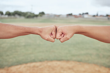 Hands, fist bump and friends outdoor in nature for partnership, friendship and support on a field. Baseball or softball pitch, team building and men athletes doing a solidarity gesture together.