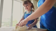 Mother Daughter Preparing Dough In The Kitchen. Happy Family Cooking Baking Together. Mother And Small Child Lifestyle Preparing Homemade Cakes From Flour And Dough. Happy Family Cooking At Home