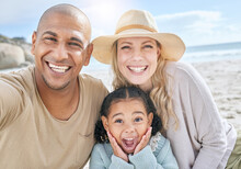 Selfie, Beach And Portrait Of A Happy Family On Vacation Together In Nature By The Ocean. Happy, Smile And Parents With Their Girl Child Taking Photo While Relaxing At Seaside On Holiday Or Adventure