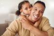 © Beaunitta V W/peopleimages.com - Love, family and girl and father kiss on a sofa while bonding, relax and hug in a living room in their home together. Happy family, smile and portrait of loving child embrace parent on couch indoors