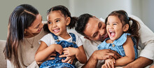 Love, Care And Parents With Happy Family Of Children Laughing Together At Home In Puerto Rico. Mama, Father And Daughter Siblings Bonding In House With Cheerful Affection And Excited Smile.