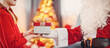 © candy1812 - Hands of Santa Claus giving giftbox to the child.
