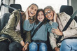 © Allistair/peopleimages.com - Road trip, family and travel with child, mother and grandma feeling happy, traveling together in back seat of car for fun. Women and girl kid using transportation and enjoy Australia journey
