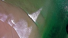 Aerial Top View Of A Lone Surfer On A Beach In Ogunquit, Maine