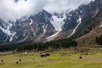 Sticker - Beautiful mountains in the Yumesamdong valley with fluffy clouds over