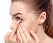 © Galaxy_love_design - Young woman wearing contact lenses.