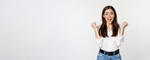 Excited Young Adult Woman Reacting To Win, Surprise News, Screaming And Cheering, Triumphing, Achieve Goal And Celebrating, Standing Over White Background