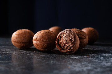 Canvas Print - Tasty chocolate balls on a stone dark table.