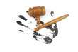 Broken judge gavel on black hand print on white background. Crime and injustice concept.