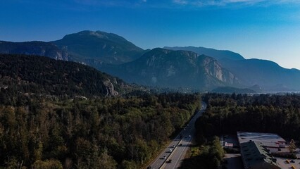 Sticker - Aerial view of  cars driving on the highway in the middle of the forest