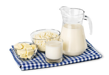 Wall Mural - A glass of milk and a milk jug on plaid tablecloth