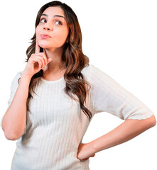 Wall Mural - Young pretty Latin woman looking sideways with doubtful and skeptical expression. PNG