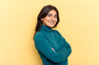 © Asier - Young Indian woman isolated on yellow background who feels confident, crossing arms with determination.