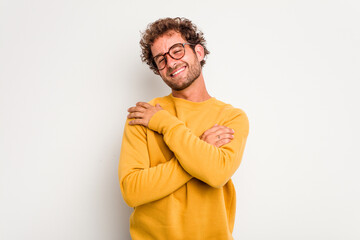 Wall Mural - Young caucasian curly hair man isolated on white background laughing and having fun.