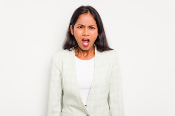 Wall Mural - Young business Indian woman isolated on white background screaming very angry and aggressive.