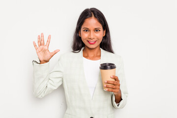 Wall Mural - Young business Indian woman holding takeaway coffee isolated on white background smiling cheerful showing number five with fingers.