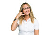 © Asier - Young caucasian woman isolated on green chroma background showing a mobile phone call gesture with fingers.