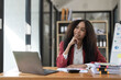 © wichayada - Asian Business woman using calculator and laptop for doing math finance on an office desk, tax, report, accounting, statistics, and analytical research concept