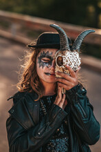 Teenage Girl In Hard Rock Costumes Celebrate Halloween Party