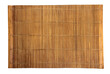 © zurbagan - Brown bamboo food mat on wooden table.