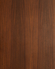 Wood texture background. Walnut surface from a mid-century modern gentleman's chest. Vertical wood grain banner. 