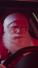Santa Claus Annoyed In Car Stuck In Traffic. Vertical Video.