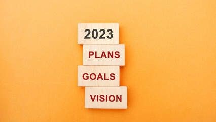 Wooden blocks with the word 2023, plans, goals, vision. Setting goal, target for next year. Plans and tasks. Financial management in company. Business and finance concept