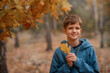 © Olena - boy with leaves in autumn park