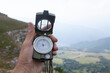 © S... - Man's hand holding a magnetic compass