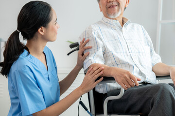 Wall Mural - Happy positive asian nurse giving support and touching contented senior man with love. Nursing home for the elderly, elderly health and illness, senior patient carer.