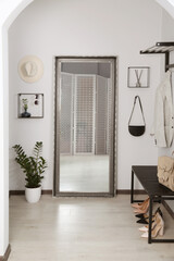 Sticker - Modern hallway interior with large mirror and houseplant