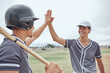 © Beaunitta V W/peopleimages.com - Baseball player, high five and team motivation for sport match, game or competition with success gesture to celebrate win. Happy team, winning and teamwork with men friends training on softball field