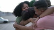 © Marco - Happy Brazilian people hugging together. South American family embrace standing outdoors. Joyful group of hispanic friends smiling 3