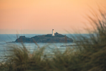 Wall Mural - sunset at godrevy lighthouse