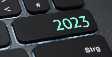 Wall Mural - a keyboard with a blue button - 2023 a keyboard with a illuminated button - 2023