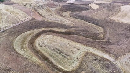 Wall Mural - Landscape of cereal crop areas with erosion ravines in autumn. Aerial view from a drone. Wheel of Eresma. Province of Segovia. Castile and Leon. Spain. Europe