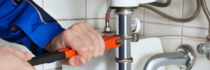 Sticker - Male Plumber Repairing Sink In Bathroom