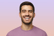 © Damir Khabirov - Close up horizontal shot of handsome smiling unshaven man in purple tshirt laughing out loud